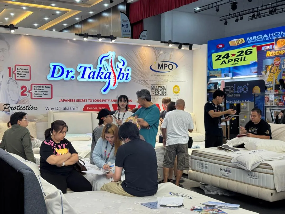 Dr. Takashi meeting customers at a Malaysian home exhibition.